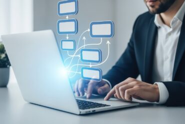 medium-vecteezy_businessman-using-laptop-with-flowchart-overlay_70682919_medium